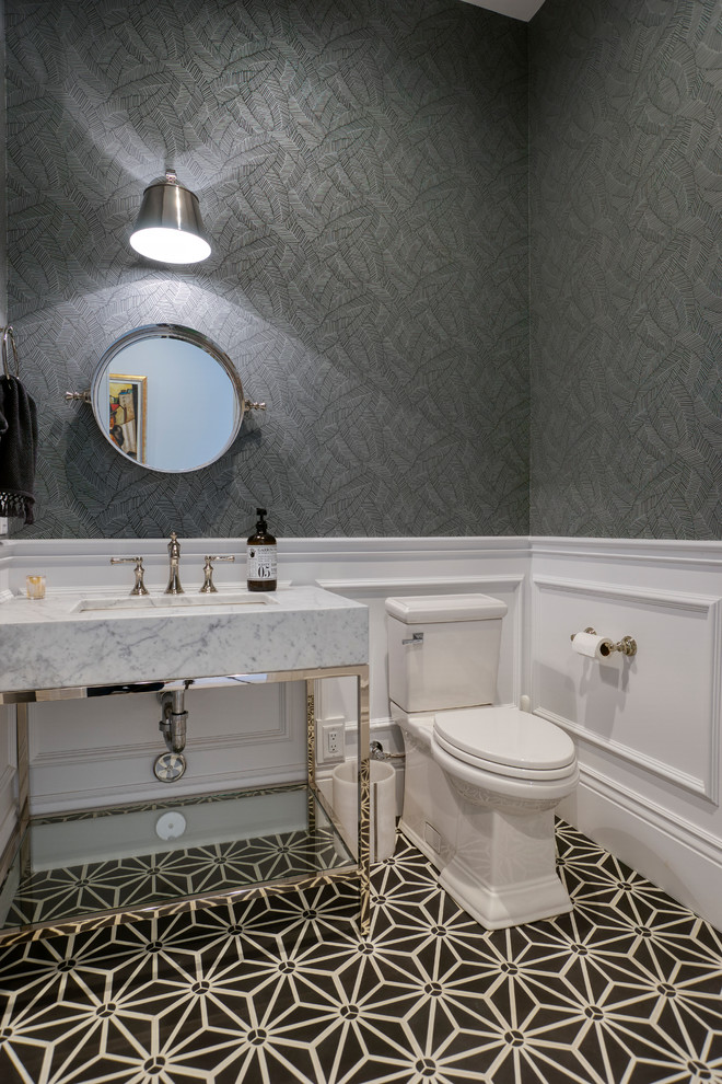 Inspiration for a small transitional powder room in Phoenix with a two-piece toilet, grey walls, a console sink, multi-coloured floor, grey benchtops, furniture-like cabinets and marble benchtops.
