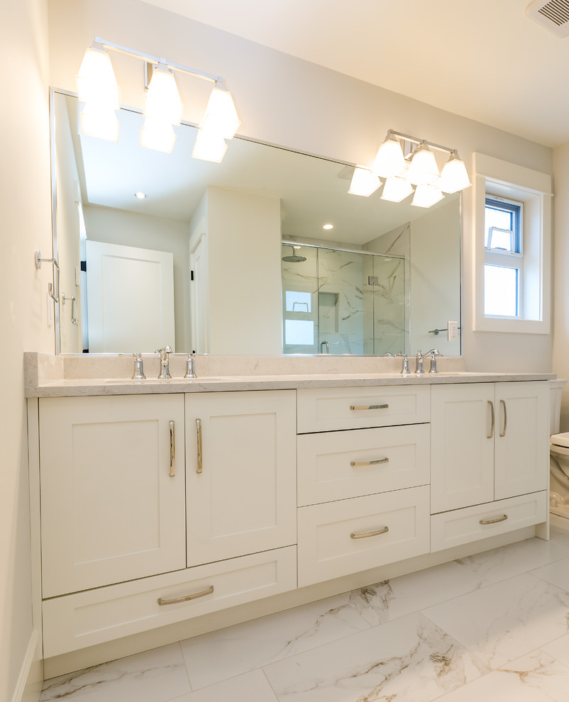 Bathroom - large transitional master marble floor bathroom idea with shaker cabinets, white cabinets, quartz countertops and white countertops