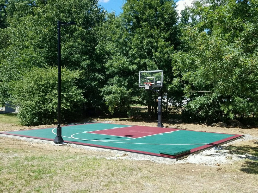 Small traditional backyard partial sun outdoor sport court in Boston with with outdoor playset and concrete pavers.
