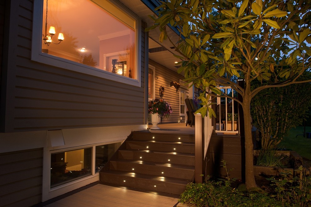 Deck - mid-sized transitional backyard deck idea in Vancouver with a roof extension