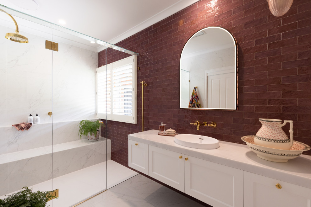 Inspiration for a transitional bathroom in Melbourne with recessed-panel cabinets, white cabinets, an alcove shower, red tile, subway tile, a vessel sink, white floor, a hinged shower door, white benchtops, a shower seat, a single vanity and a floating vanity.