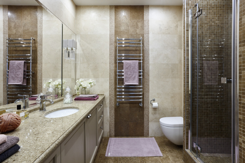 Inspiration for a mid-sized contemporary 3/4 bathroom in Moscow with recessed-panel cabinets, beige cabinets, an alcove shower, a wall-mount toilet, beige tile, travertine, travertine floors, an undermount sink, engineered quartz benchtops, beige floor and a hinged shower door.