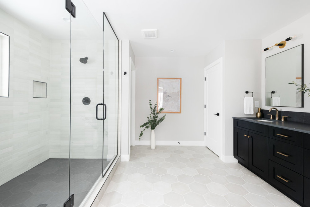 Inspiration for a large classic ensuite bathroom in Denver with shaker cabinets, black cabinets, a double shower, white tiles, porcelain tiles, grey walls, porcelain flooring, a submerged sink, engineered stone worktops, grey floors, a hinged door, grey worktops, an enclosed toilet, double sinks and a built in vanity unit.