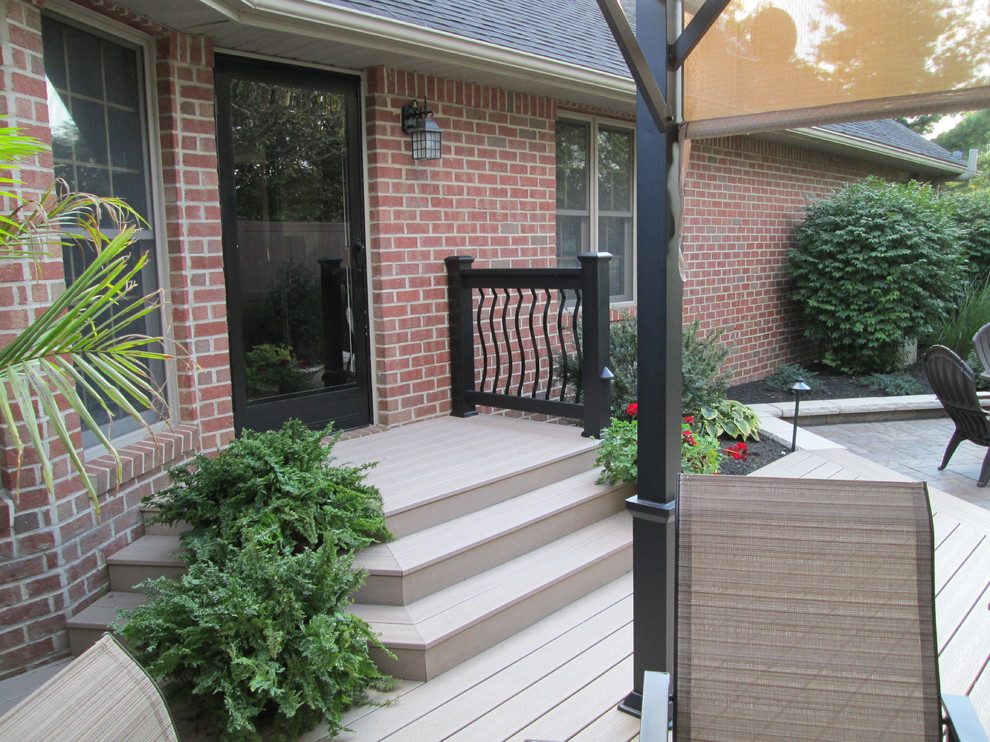 Inspiration for a small transitional backyard deck remodel