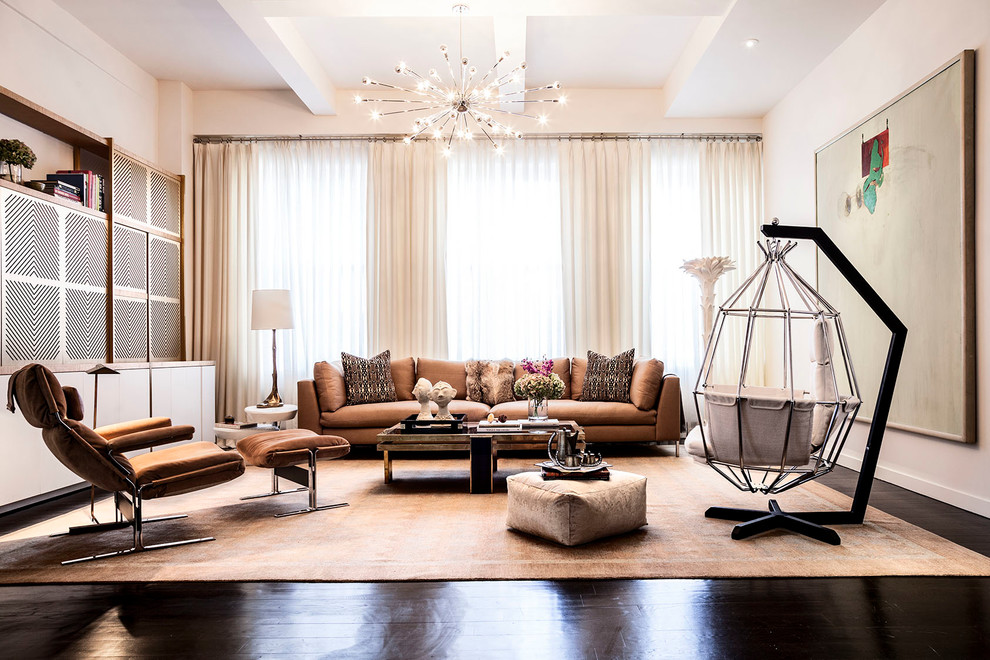 Inspiration for a contemporary family room in New York with beige walls and dark hardwood floors.