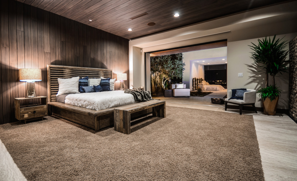 Photo of a large contemporary master bedroom in Las Vegas with timber.