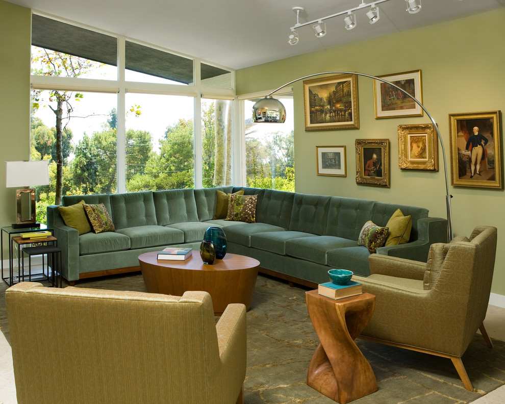 Design ideas for a contemporary living room in Los Angeles with green walls and no tv.