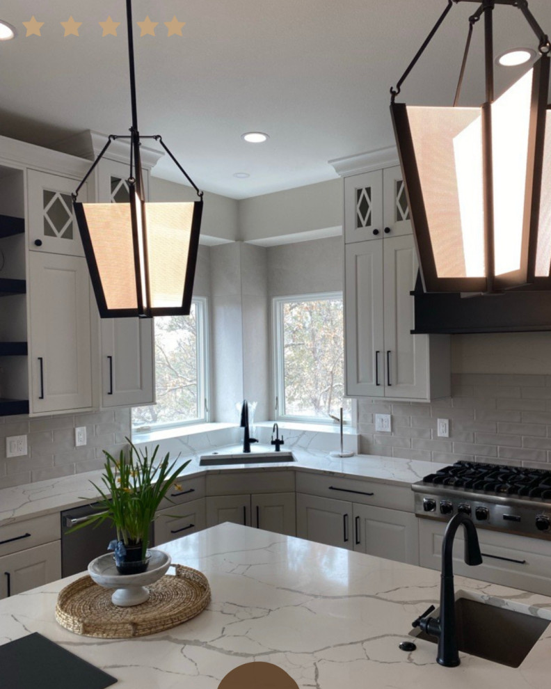 Example of a dark wood floor kitchen pantry design in Denver with quartzite countertops and an island