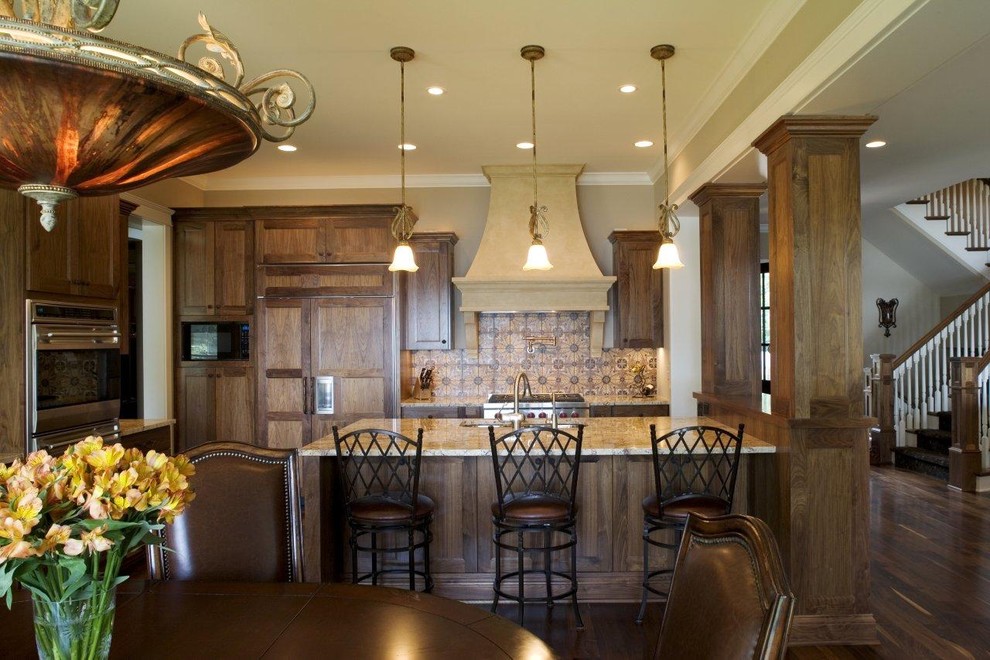 This is an example of a traditional kitchen in Minneapolis with panelled appliances.