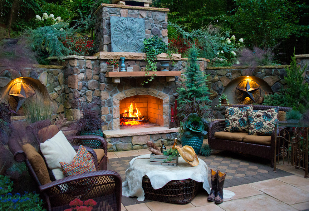 Inspiration for a large rustic backyard concrete paver shade patio remodel in DC Metro with a fire pit