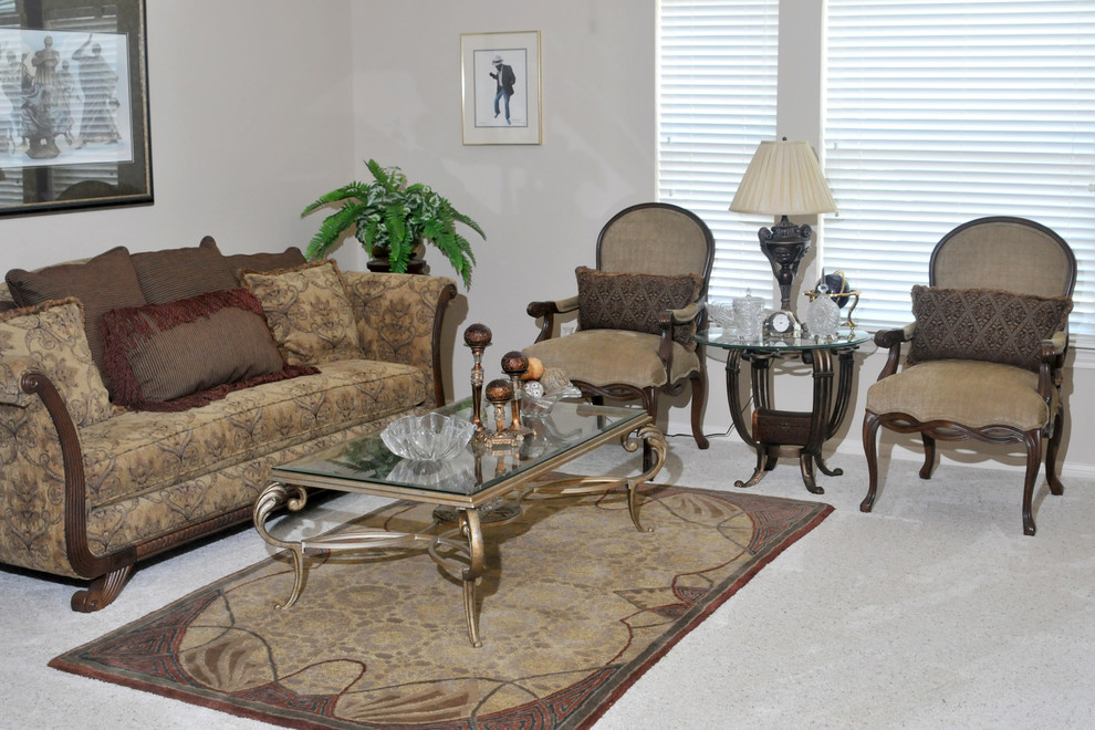 Photo of a mid-sized traditional living room in Houston with beige walls, carpet and a freestanding tv.
