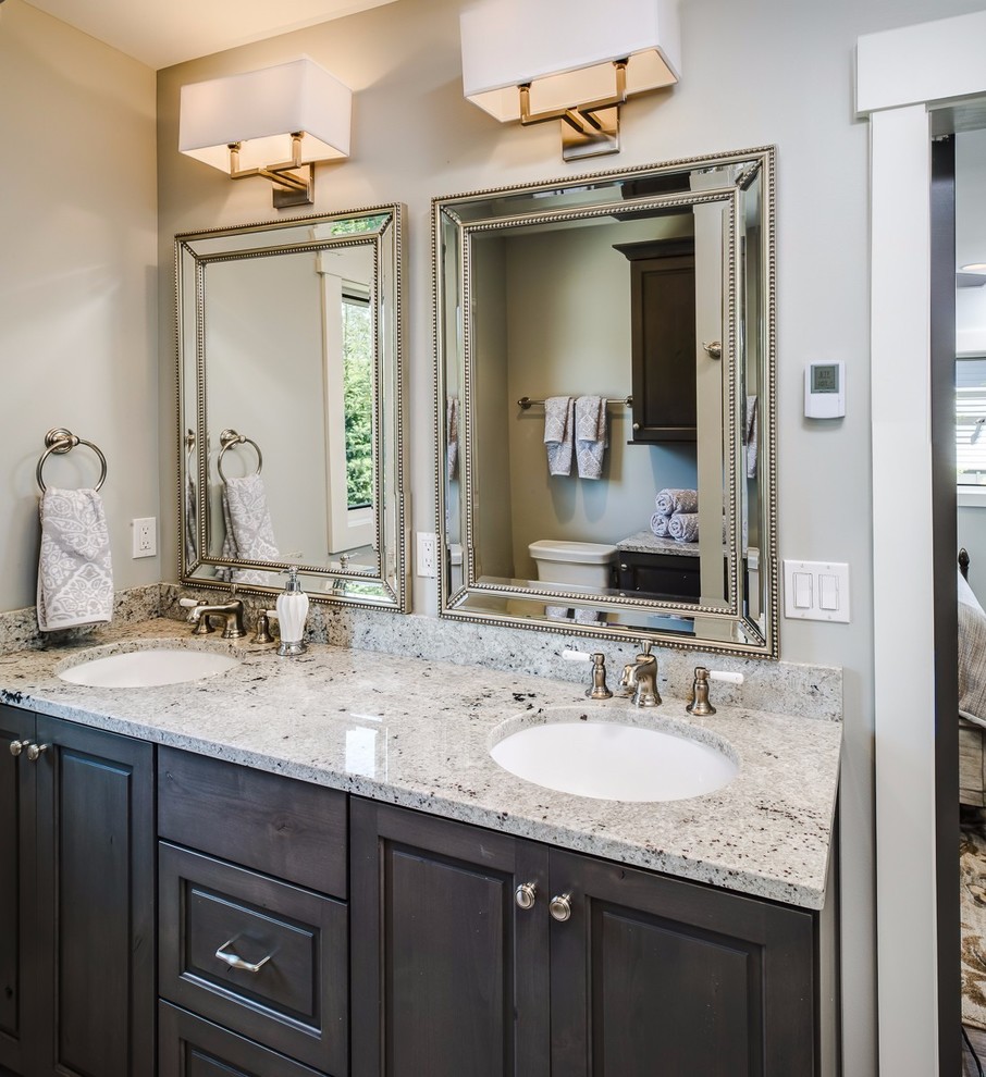 Design ideas for a mid-sized transitional master bathroom in Other with raised-panel cabinets, dark wood cabinets, grey walls, an undermount sink and granite benchtops.