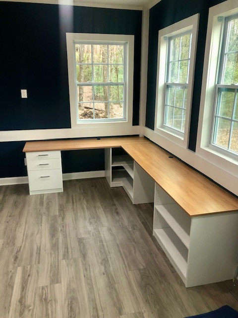 Built-in Desk with Two Seating Areas and Wrap-Around Shelving