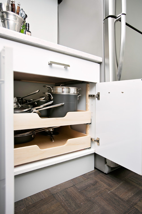 Kitchen cabinet with concealed soft-close European hinges and full-extension roll-out shelves for pots and pans