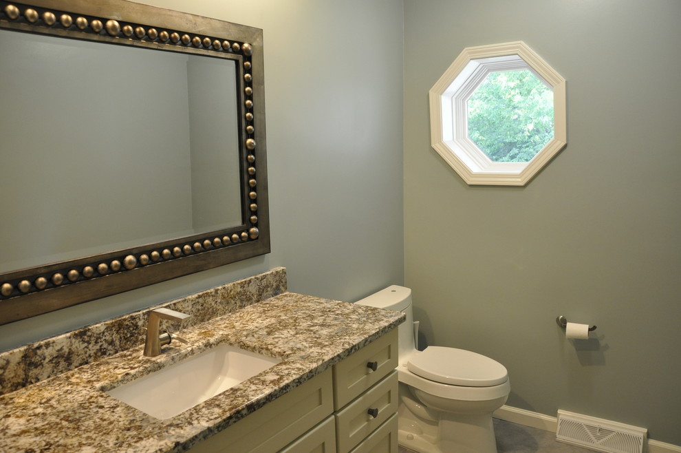 Design ideas for a mid-sized transitional powder room in Cincinnati with multi-coloured benchtops.