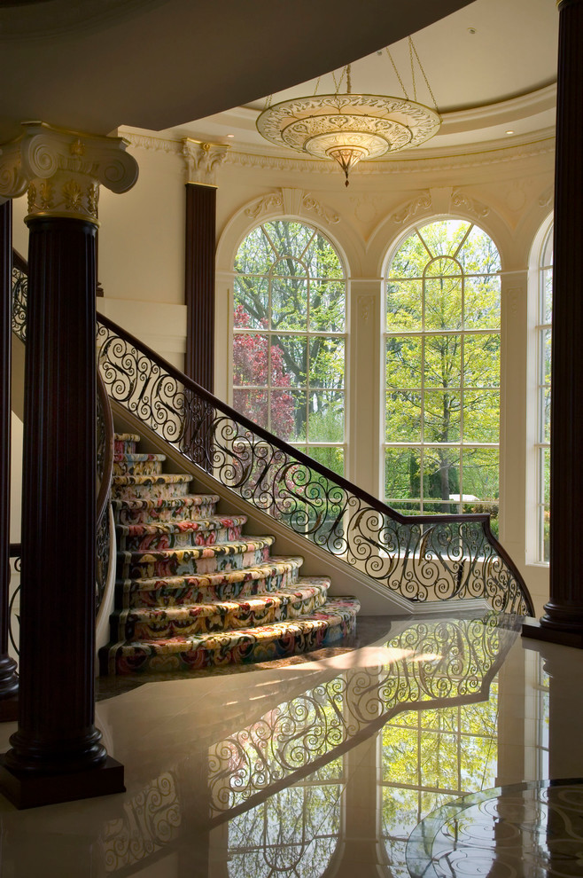 Photo of a traditional curved staircase in Detroit.
