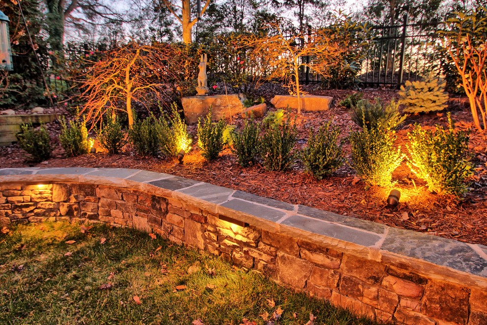 Inspiration for a mid-sized traditional backyard full sun garden for fall in Charlotte with a garden path and mulch.