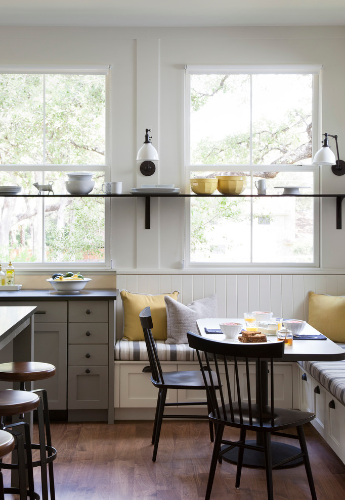 This is an example of a country eat-in kitchen in Austin with recessed-panel cabinets and grey cabinets.