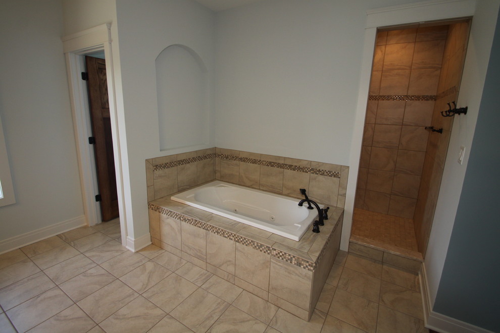 Design ideas for a large arts and crafts master bathroom in Chicago with an undermount sink, shaker cabinets, dark wood cabinets, granite benchtops, a drop-in tub, an open shower, a two-piece toilet, brown tile, ceramic tile, brown walls and ceramic floors.
