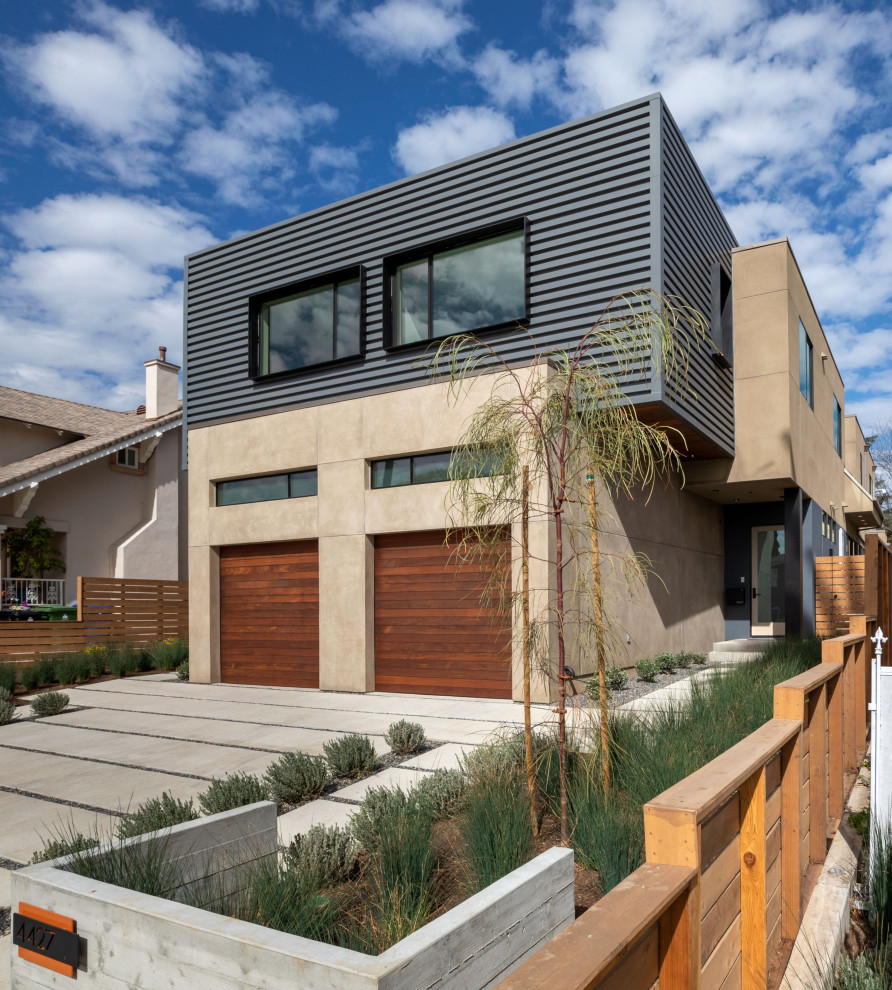 This is an example of a modern two-storey duplex exterior in Los Angeles with metal siding.