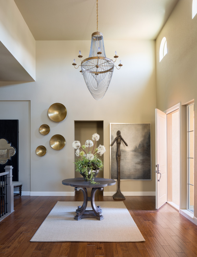 Transitional entryway photo in Denver with beige walls