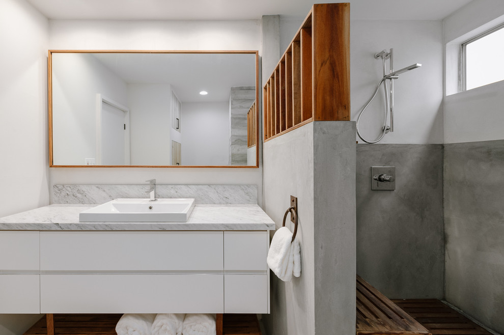 Inspiration for a mid-sized midcentury 3/4 bathroom in Los Angeles with flat-panel cabinets, white cabinets, an open shower, a vessel sink, marble benchtops, an open shower and grey benchtops.