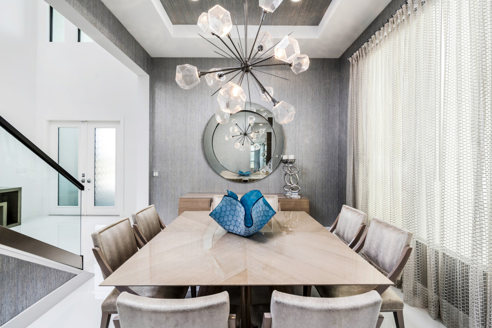 Large contemporary open plan dining room in Miami with metallic walls, marble flooring, white floors, a wallpapered ceiling and wallpapered walls.