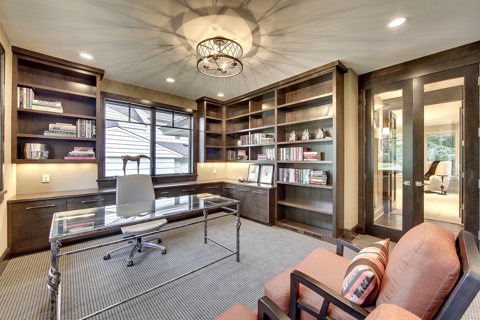 Photo of a transitional home office in Minneapolis with carpet and a freestanding desk.