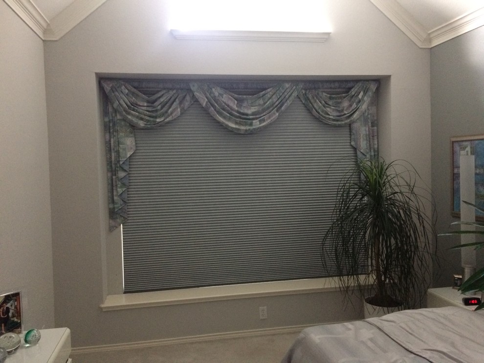 Example of a transitional bedroom design in Dallas