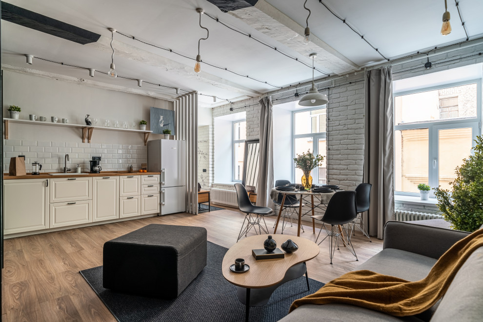 This is an example of a medium sized scandi grey and white living room feature wall in Saint Petersburg with yellow walls, beige floors, exposed beams, wood walls and laminate floors.