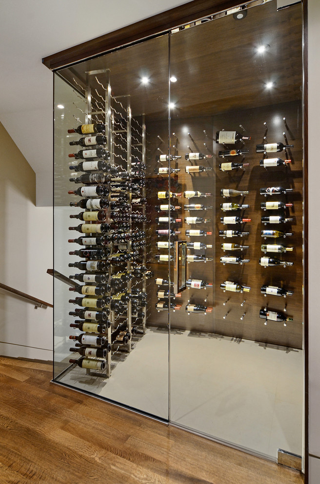 This is an example of a contemporary wine cellar in Calgary.