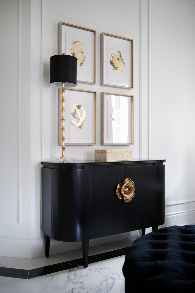 Inspiration for a mid-sized transitional porcelain tile and white floor foyer remodel in Toronto with white walls