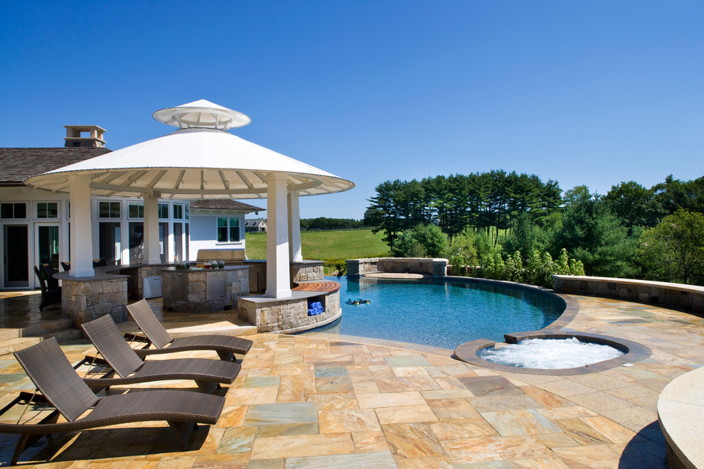 Design ideas for an expansive modern backyard custom-shaped infinity pool in Boston with a hot tub and tile.