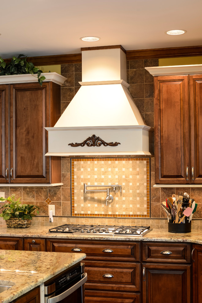 Large transitional u-shaped medium tone wood floor eat-in kitchen photo with beaded inset cabinets, medium tone wood cabinets, granite countertops, beige backsplash, mosaic tile backsplash, stainless steel appliances and an island