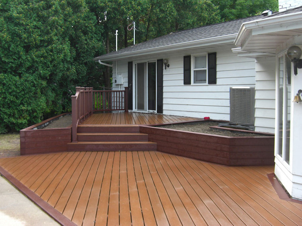 Example of a mid-sized backyard deck design with no cover
