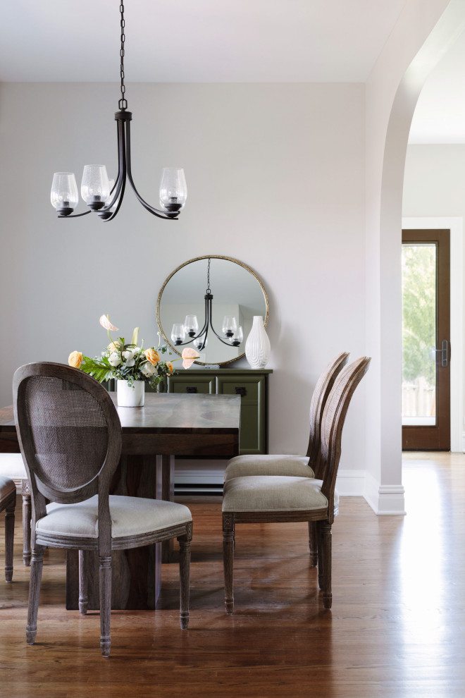 Inspiration for a transitional separate dining room in Chicago with grey walls, medium hardwood floors and no fireplace.