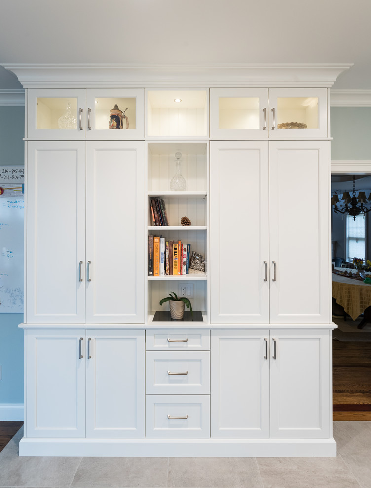 Example of a large transitional galley ceramic tile and gray floor open concept kitchen design in Bridgeport with an undermount sink, recessed-panel cabinets, white cabinets, granite countertops, gray backsplash, ceramic backsplash, stainless steel appliances, two islands and black countertops