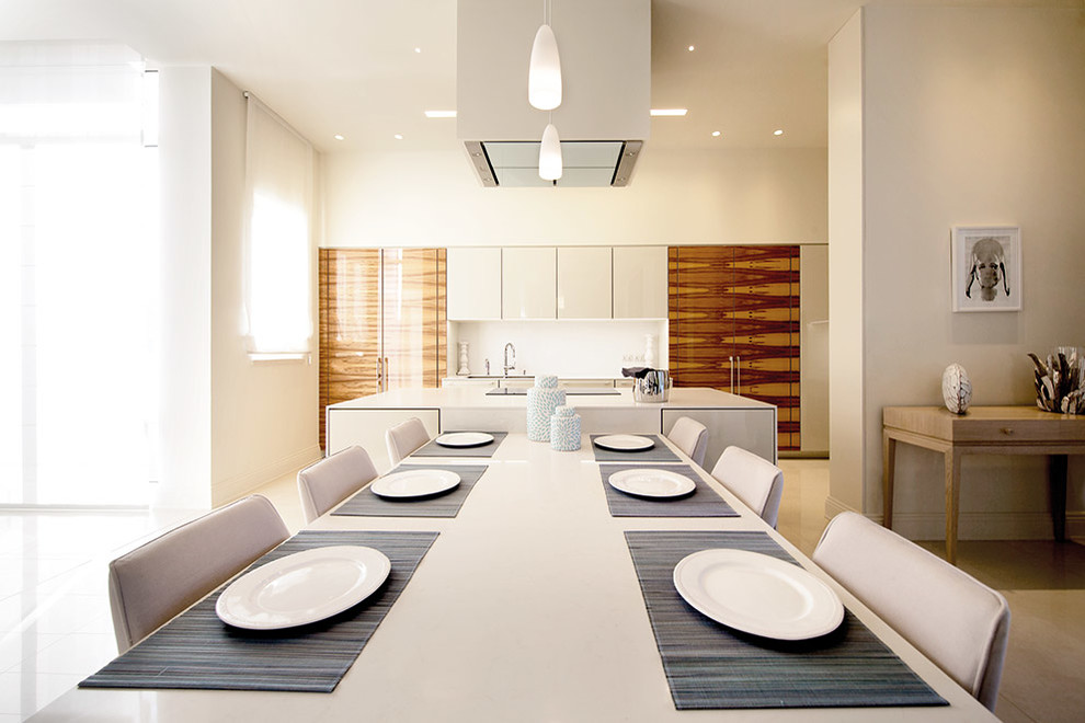 Inspiration for a mid-sized contemporary open plan dining in Other with white walls and concrete floors.