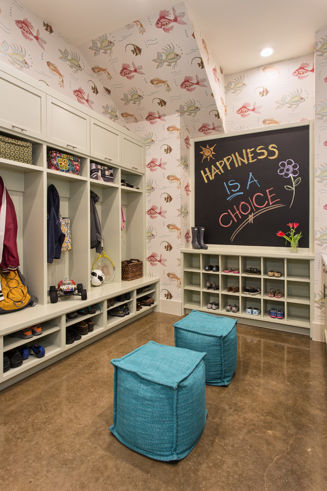 Photo of a mid-sized transitional mudroom in Austin with concrete floors and multi-coloured walls.