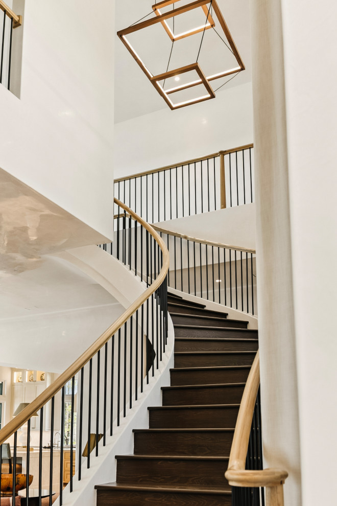 Example of a huge transitional wooden floating wood railing staircase design with metal risers