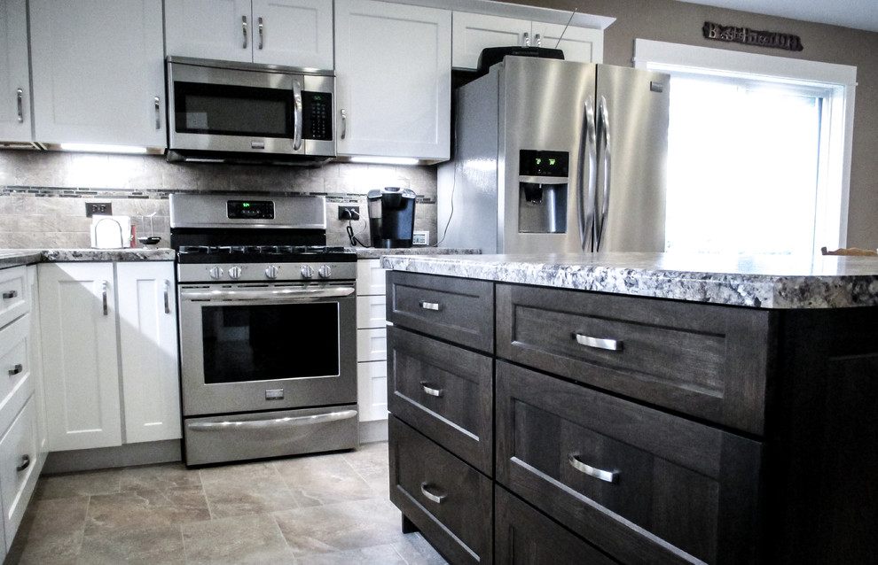 Inspiration for a mid-sized transitional l-shaped vinyl floor eat-in kitchen remodel with white cabinets, stainless steel appliances, an island, shaker cabinets, granite countertops, gray backsplash and ceramic backsplash