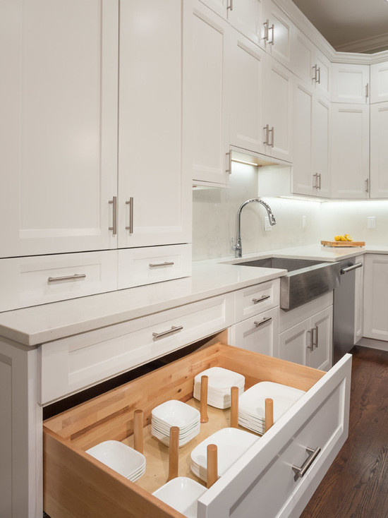 Inspiration for a large transitional l-shaped dark wood floor eat-in kitchen remodel in Chicago with a farmhouse sink, shaker cabinets, white cabinets, marble countertops, white backsplash, subway tile backsplash, stainless steel appliances and an island