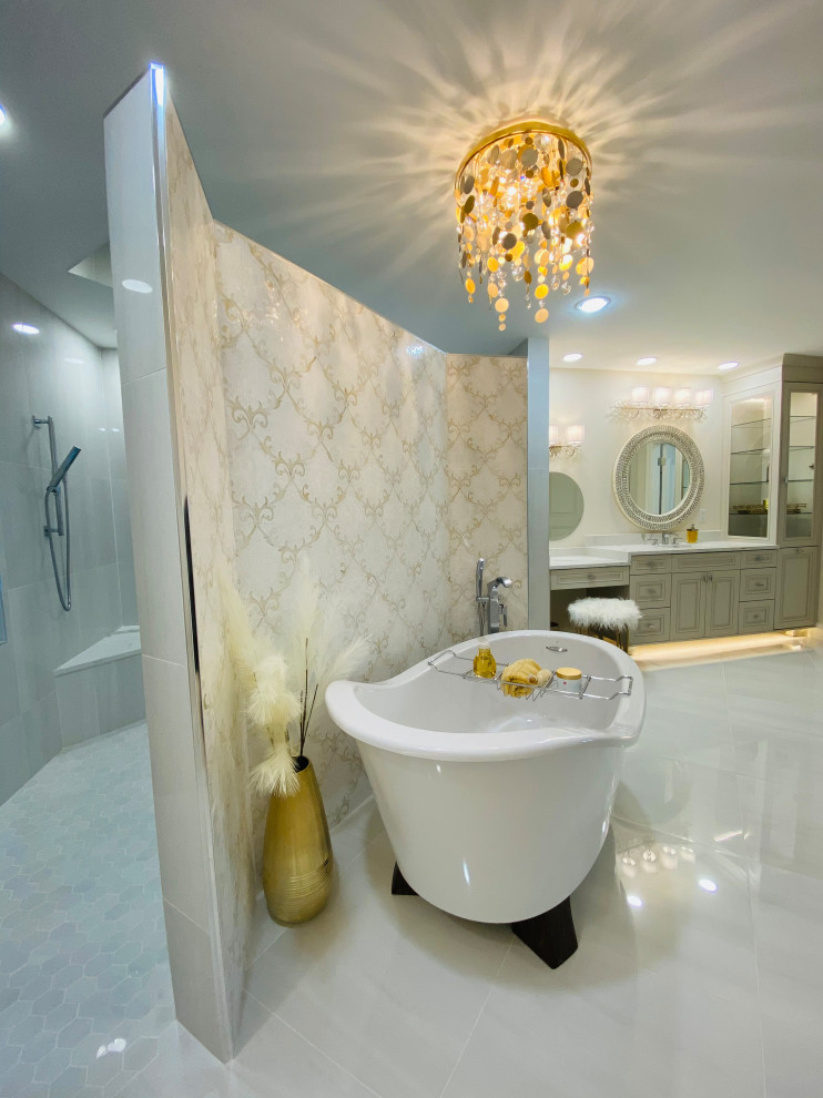 Design ideas for a large modern ensuite bathroom in Tampa with recessed-panel cabinets, beige cabinets, a freestanding bath, a double shower, a bidet, grey tiles, marble tiles, grey walls, marble flooring, a submerged sink, marble worktops, an open shower, white worktops, a wall niche, double sinks and a built in vanity unit.