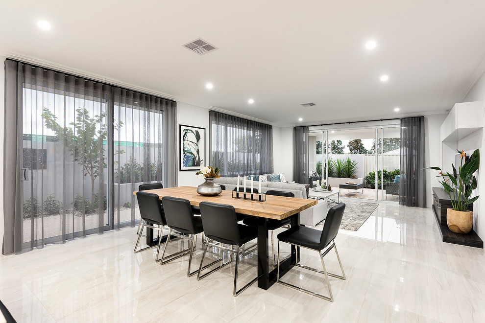 This is an example of a mid-sized contemporary kitchen/dining combo in Perth with white walls and porcelain floors.