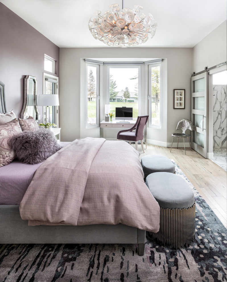 Inspiration for a mid-sized contemporary master bedroom in Sacramento with purple walls, light hardwood floors, a standard fireplace, a metal fireplace surround and beige floor.