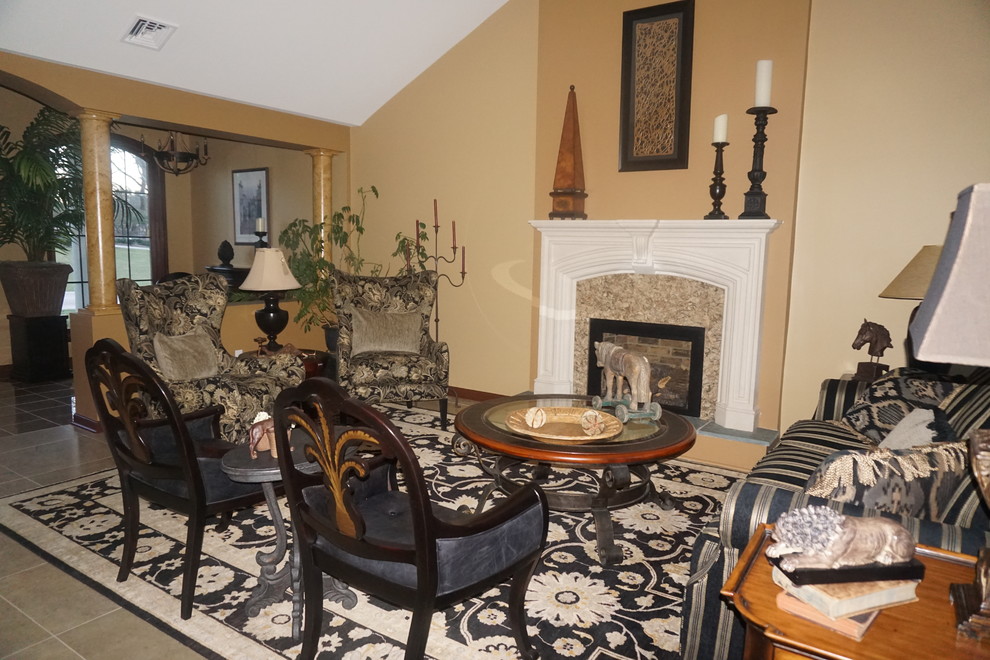 Photo of a large mediterranean formal open concept living room in Philadelphia with porcelain floors, a standard fireplace, a stone fireplace surround and no tv.