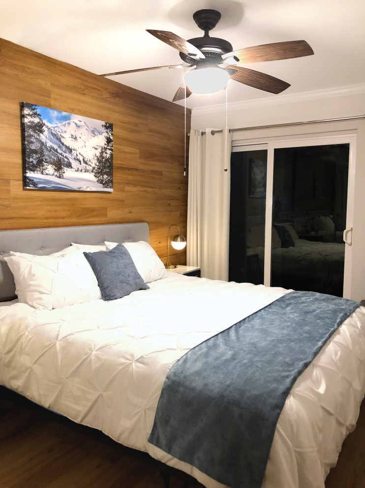 Foto de dormitorio principal campestre pequeño con paredes blancas, suelo vinílico y madera