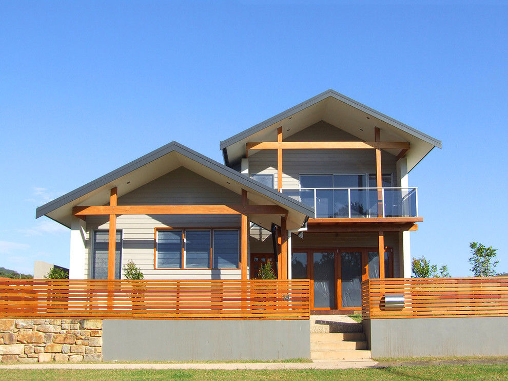This is an example of a beach style two-storey exterior in Sydney with a gable roof.