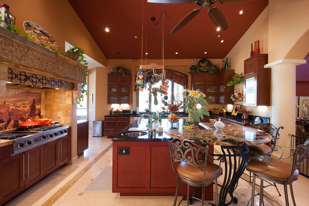 Inspiration for a mediterranean kitchen in Los Angeles with shaker cabinets, medium wood cabinets and beige splashback.
