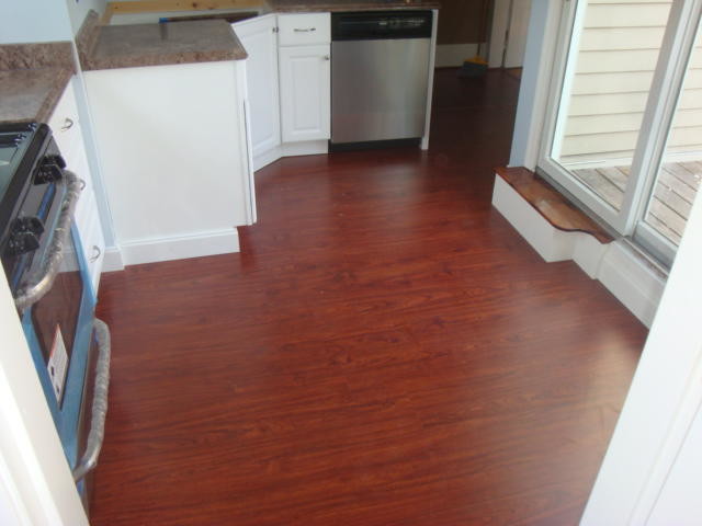 Kitchen - medium tone wood floor kitchen idea in Boston with raised-panel cabinets, white cabinets, blue backsplash, stainless steel appliances and no island